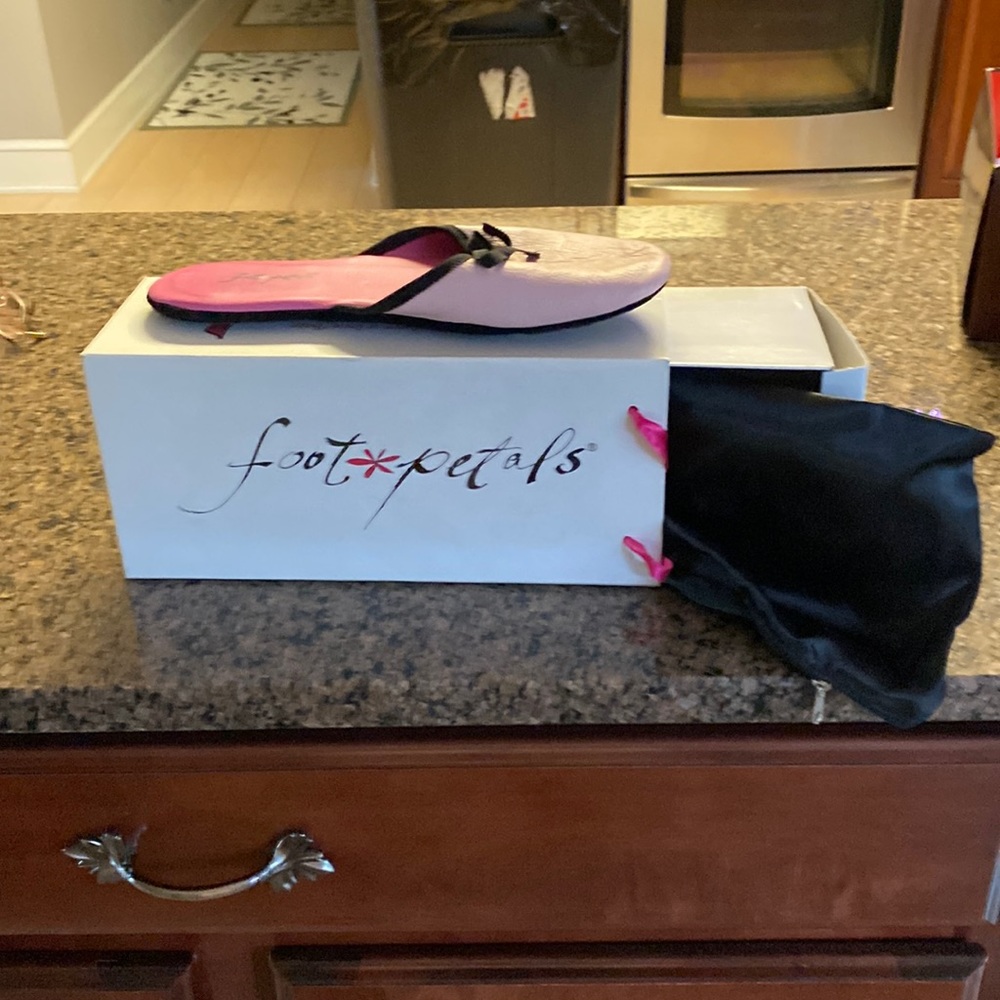 Foot pedals. Pink and black size large , never worn  traveling slippers
